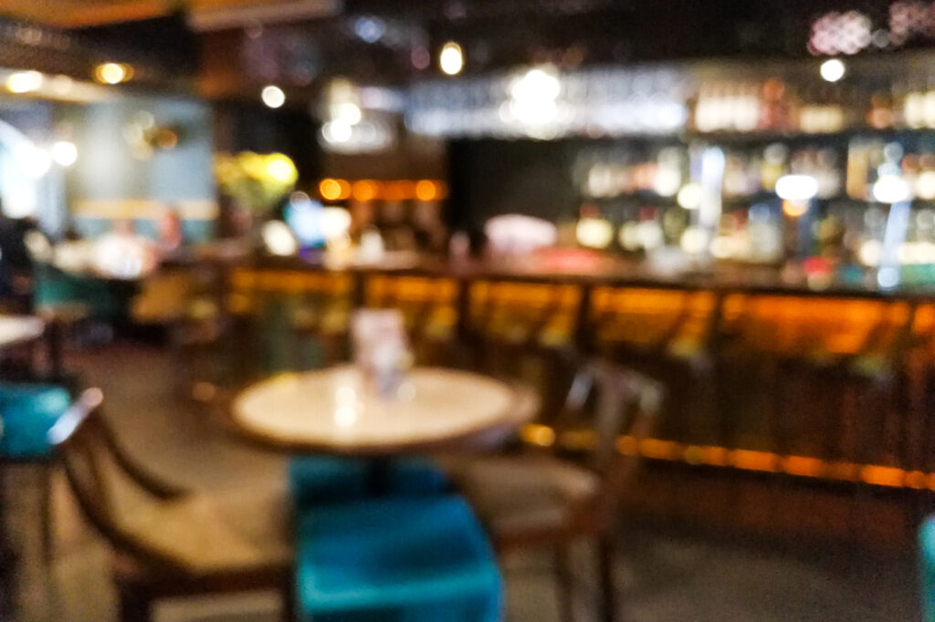 Blur vision perspective view of a drunk person in pub