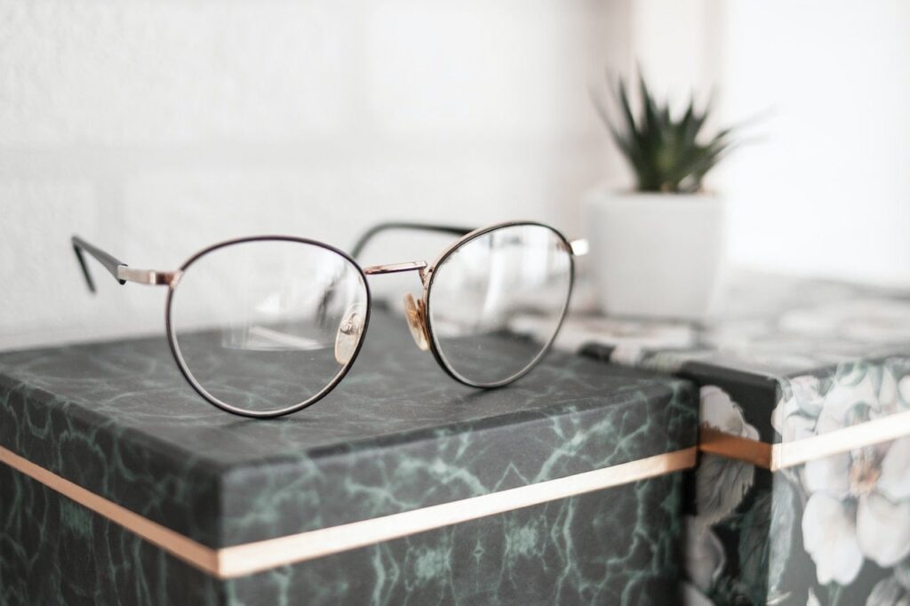 focused shot of eyeglasses on top of a box